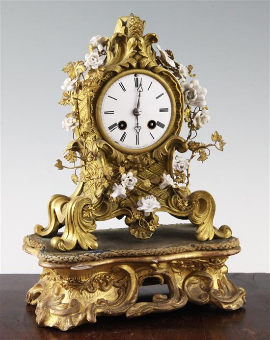 A 19th century French ormolu mantel clock, 8.5in., with additional giltwood plinth